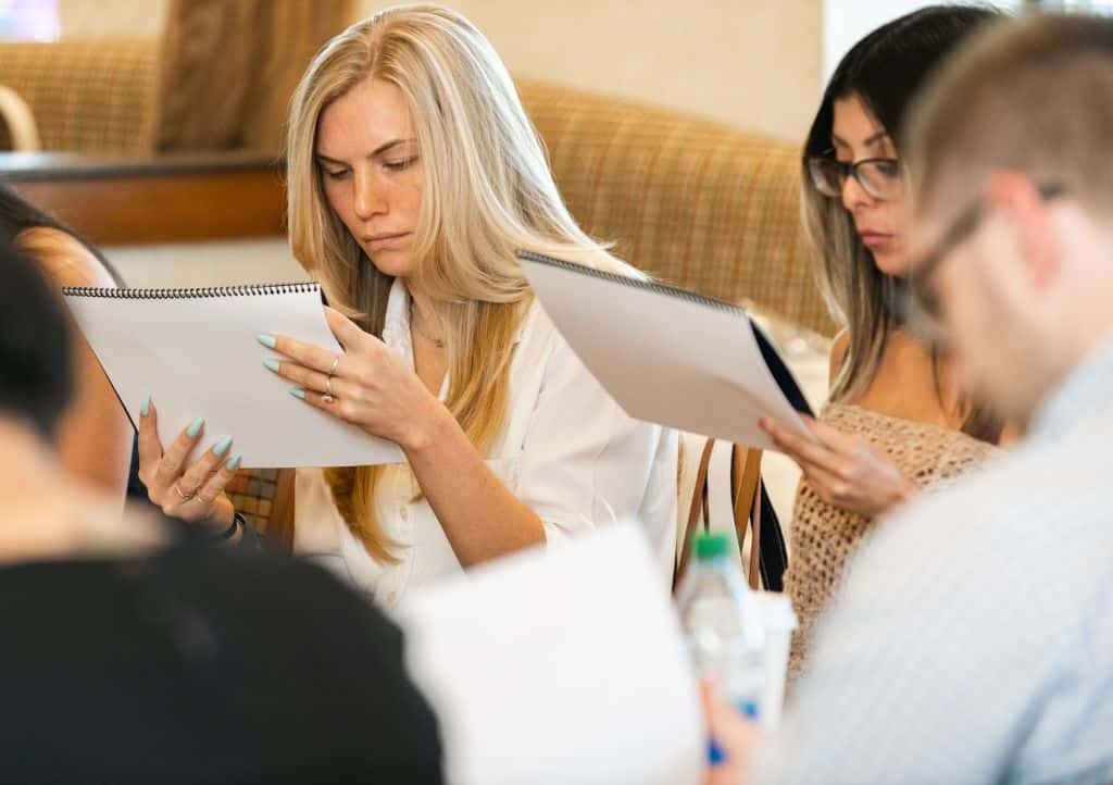 Team evaluating veterinary practice financials and operations during assessment stage.