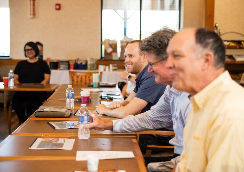 Ackerman Group team meeting to identify and discuss potential buyers for a veterinary practice