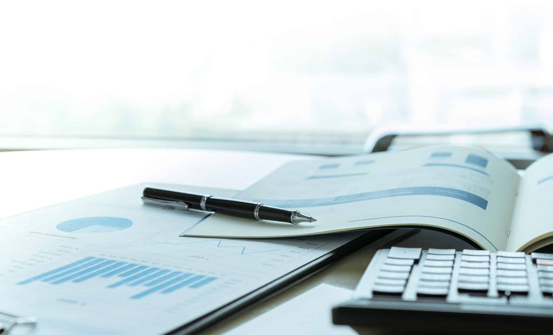 Clipboard and laptop used in planning the transition after a veterinary practice sale.