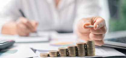 Veterinarian reviewing real estate documents for a veterinary property decision